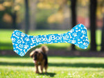 Load image into Gallery viewer, Blue dog toy with 'FlexyBone' pattern on a wooden floor
